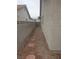Gravel side yard features stepping stones between a block wall and the side of the home at 3116 Gentle Breeze St, Las Vegas, NV 89108