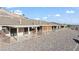 Relaxing backyard featuring a covered patio, neutral color scheme, and minimal landscaping at 3161 Quail Song Dr # 3161, Laughlin, NV 89029