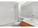 Bright bathroom featuring a shower-tub combination, a mirror and a wooden vanity at 3161 Quail Song Dr # 3161, Laughlin, NV 89029