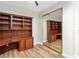 Bedroom featuring custom built-in shelving with a mirrored closet door at 3161 Quail Song Dr # 3161, Laughlin, NV 89029
