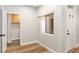 Bedroom with wood-look floors and a doorway to the laundry room at 3161 Quail Song Dr # 3161, Laughlin, NV 89029