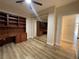 Bedroom with wood-look floors and built-in shelving at 3161 Quail Song Dr # 3161, Laughlin, NV 89029