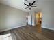 Spacious bedroom featuring wood-look flooring and a modern ceiling fan at 3161 Quail Song Dr # 3161, Laughlin, NV 89029