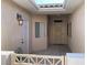 The front courtyard includes a white security gate, a skylight, and a front door with a screen at 3161 Quail Song Dr # 3161, Laughlin, NV 89029