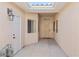 Inviting entryway features a skylight, decorative door, and neutral color scheme at 3161 Quail Song Dr # 3161, Laughlin, NV 89029