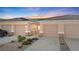 Charming single-story home with well-kept yard, two-car garage, and desert landscaping at 3161 Quail Song Dr # 3161, Laughlin, NV 89029