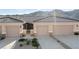 Charming townhome featuring a neutral color scheme, attached garage and low-maintenance landscaping at 3161 Quail Song Dr # 3161, Laughlin, NV 89029