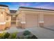 Charming single-story home featuring a well-kept yard, two-car garage, and tiled roof at 3161 Quail Song Dr # 3161, Laughlin, NV 89029