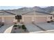 Charming townhome featuring a neutral color scheme, attached garage and low-maintenance landscaping at 3161 Quail Song Dr # 3161, Laughlin, NV 89029