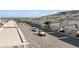 Desert community homes featuring tile roofs, attached garages and desert landscaping at 3161 Quail Song Dr # 3161, Laughlin, NV 89029