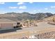 Beautiful exterior view showcasing mountain views, desert landscaping, and neutral paint at 3161 Quail Song Dr # 3161, Laughlin, NV 89029