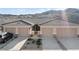 Charming townhome featuring a neutral color scheme, attached garage and low-maintenance landscaping at 3161 Quail Song Dr # 3161, Laughlin, NV 89029