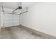 Spacious garage with auto door opener and sealed concrete flooring, ready for vehicles and storage at 3161 Quail Song Dr # 3161, Laughlin, NV 89029