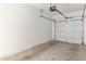 Garage with auto door opener and sealed concrete flooring, ready for vehicles and storage at 3161 Quail Song Dr # 3161, Laughlin, NV 89029