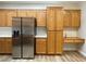 Kitchen with stainless steel refrigerator and built-in desk at 3161 Quail Song Dr # 3161, Laughlin, NV 89029
