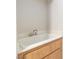 Laundry room with sink set in wood cabinets providing practicality and extra utility at 3161 Quail Song Dr # 3161, Laughlin, NV 89029