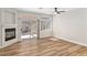 Bright living room featuring wood floors, a fireplace, and sliding doors to the patio at 3161 Quail Song Dr # 3161, Laughlin, NV 89029