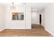 Living room with wood floors, modern lighting, and view into other rooms at 3161 Quail Song Dr # 3161, Laughlin, NV 89029