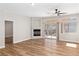 Bright living room featuring wood floors, a fireplace, and sliding doors to the patio at 3161 Quail Song Dr # 3161, Laughlin, NV 89029