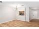 Bright living room with wood floors, modern lighting, and opening to the kitchen at 3161 Quail Song Dr # 3161, Laughlin, NV 89029