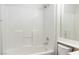 The bathroom features a shower-tub combination with white tiling, providing a clean and functional space at 3161 Quail Song Dr # 3161, Laughlin, NV 89029