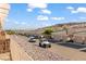 Community street view featuring desert landscaping, garages, and mountain views at 3161 Quail Song Dr # 3161, Laughlin, NV 89029