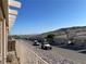 Street view of single story homes with garages and desert landscaping at 3161 Quail Song Dr # 3161, Laughlin, NV 89029
