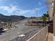 Community street view featuring desert landscape, mountains, and sunny blue skies at 3161 Quail Song Dr # 3161, Laughlin, NV 89029