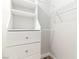 Clean walk-in closet featuring built-in storage with shelving and drawers to maximize organization at 3161 Quail Song Dr # 3161, Laughlin, NV 89029