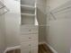 Walk-in closet with built-in shelving and hanging rods for optimal storage at 3161 Quail Song Dr # 3161, Laughlin, NV 89029