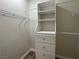 Walk-in closet with built-in shelving and hanging rods for optimal storage at 3161 Quail Song Dr # 3161, Laughlin, NV 89029