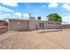 Back of house, with a large dirt backyard featuring a patio, perfect for creating an outdoor living and entertainment space at 3509 Navajo Way, Las Vegas, NV 89108