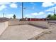 Concrete patio in dirt backyard featuring block walls and wooden fence at 3509 Navajo Way, Las Vegas, NV 89108