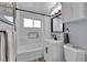 Beautifully remodeled bathroom with new fixtures, subway tile, and a tub with shower at 3509 Navajo Way, Las Vegas, NV 89108