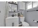 Cozy bathroom with a white vanity, a shower with stylish tile, and a window for natural light at 3509 Navajo Way, Las Vegas, NV 89108