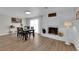 Bright dining area with a fireplace and view of art pieces, creating an inviting atmosphere for meals at 3509 Navajo Way, Las Vegas, NV 89108