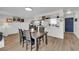 Open dining area leading to the kitchen, complemented by a painted brick fireplace in the living space at 3509 Navajo Way, Las Vegas, NV 89108