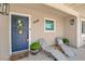 Charming front porch with lounge chairs, plants and decorative touches at 3509 Navajo Way, Las Vegas, NV 89108