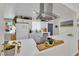 Well-lit kitchen with white cabinets, stainless steel appliances, and quartz countertops offering a clean aesthetic at 3509 Navajo Way, Las Vegas, NV 89108