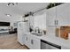 Open kitchen features modern appliances, white cabinetry, and a view into the living area at 3509 Navajo Way, Las Vegas, NV 89108