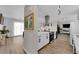Modern kitchen with sleek appliances and white cabinets seamlessly integrates with living spaces at 3509 Navajo Way, Las Vegas, NV 89108