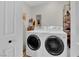 Efficient laundry room with front load washer and dryer, plus ample storage space at 3509 Navajo Way, Las Vegas, NV 89108