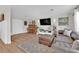Inviting living room featuring hardwood floors, neutral walls, comfortable seating and stylish decor at 3509 Navajo Way, Las Vegas, NV 89108