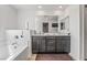 Bright bathroom with double sink vanity, soaking tub, and modern fixtures at 3641 Portici Ln, Henderson, NV 89044