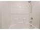 Clean, white tiled bathtub and shower combination with sleek fixtures at 3641 Portici Ln, Henderson, NV 89044