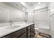 Bright bathroom featuring a double sink vanity, modern fixtures and a shower over tub at 3641 Portici Ln, Henderson, NV 89044