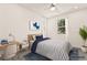 Bright bedroom featuring a desk, large window, and comfortable bed at 3641 Portici Ln, Henderson, NV 89044
