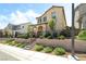 Charming two-story home with a landscaped front yard, black fence, and stairs leading to an arched doorway at 3641 Portici Ln, Henderson, NV 89044