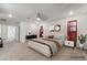 Spacious primary bedroom featuring cozy decor, carpet flooring, and a ceiling fan at 3641 Portici Ln, Henderson, NV 89044