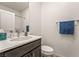 Stylish powder room featuring dark wood vanity and modern fixtures at 3641 Portici Ln, Henderson, NV 89044